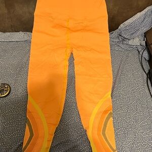 NWOT FP Movement by Free People Bright Orange and Yellow Leggings